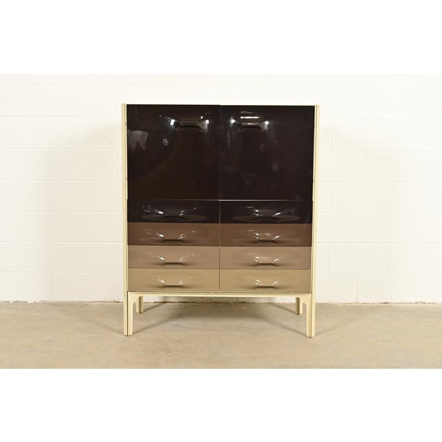 A rare and exceptional Mid-Century Modern Space Age highboy dresser or gentleman's chest By Raymond Loewy for Doubinsky...