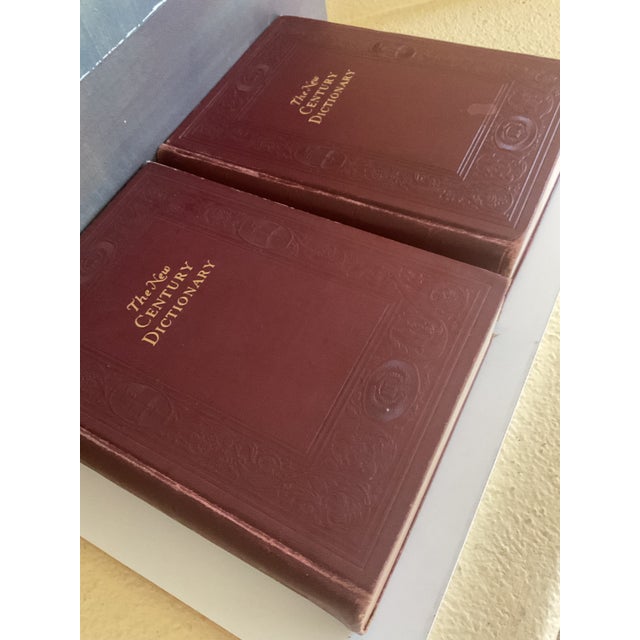 Those are handsome volumes of The New Century Dictionary, published by Appleton Century in the early 20th century — a two-...