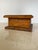 A charming hand-carved wooden folk art box featuring a carved star medallion set within a geometric bordered lid, and bold...