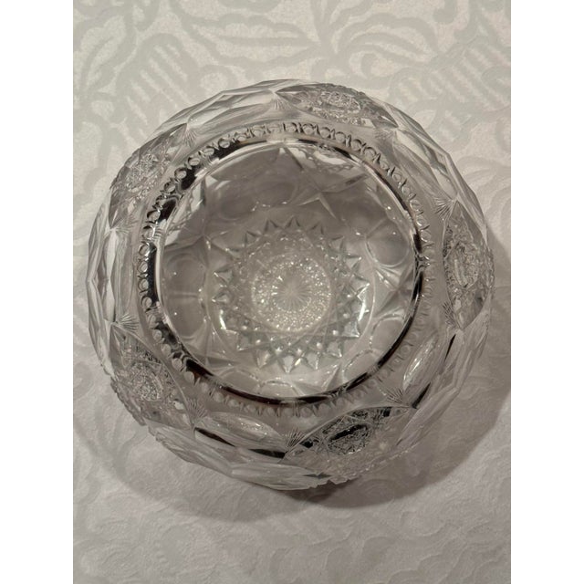 This is a rare find of a globe shaped extensively hand cut crystal vase by Hawkes. It has the Hawkes mark at the bottom...
