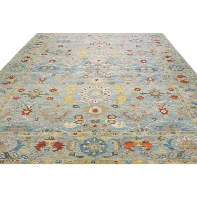 Beautiful modern Sultanabad hand-knotted wool rug with a light blue field. This Sultanabad rug has multicolor accents in a...