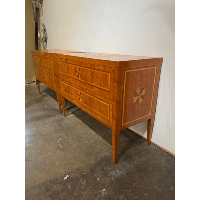 Good pair of Italian walnut Neo-classical star inlaid commodes. These commodes are ideal for adding architectural...