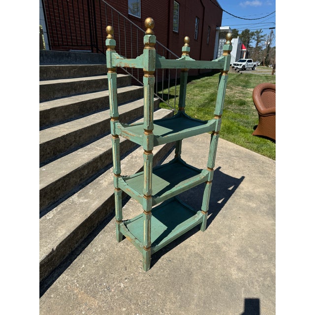 The perfect little blue green French style shelf with gold leather finials and accents. Sturdy and ready to go. Not old or...