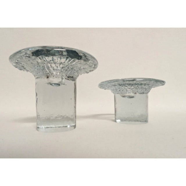 A pair of Blenko mushroom candle holders. The mid-century art glass candlesticks are lovely with a thick stem and textured...