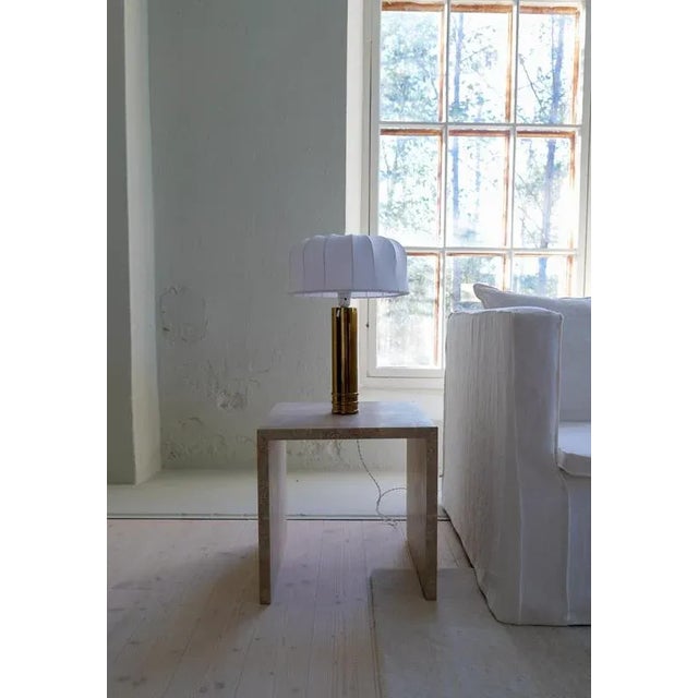 Large and heavy cylinder-shaped table lamp in brass. Bergboms design with all new cotton shades, made in Sweden. Cast iron...