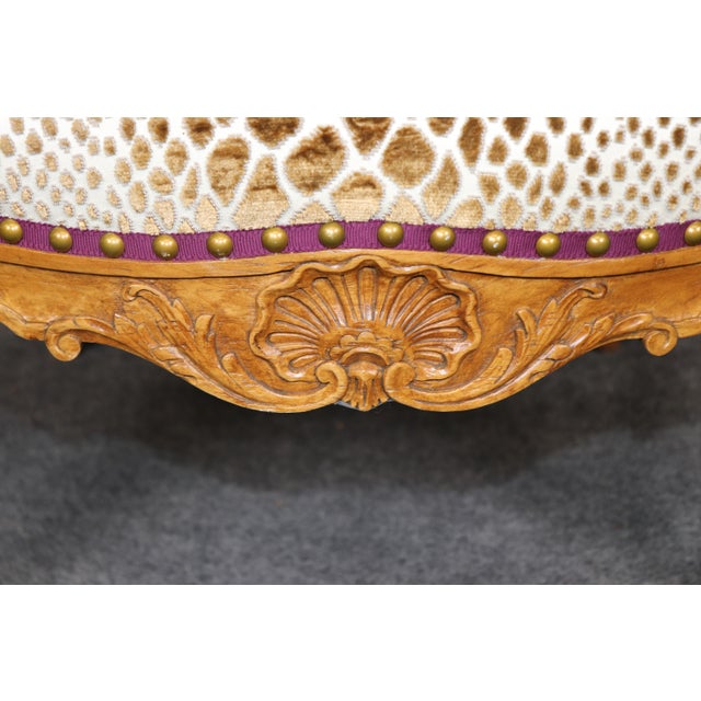 An exceptional French Louis XV style fauteuil, this sophisticated armchair is a masterful blend of timeless eighteenth-...