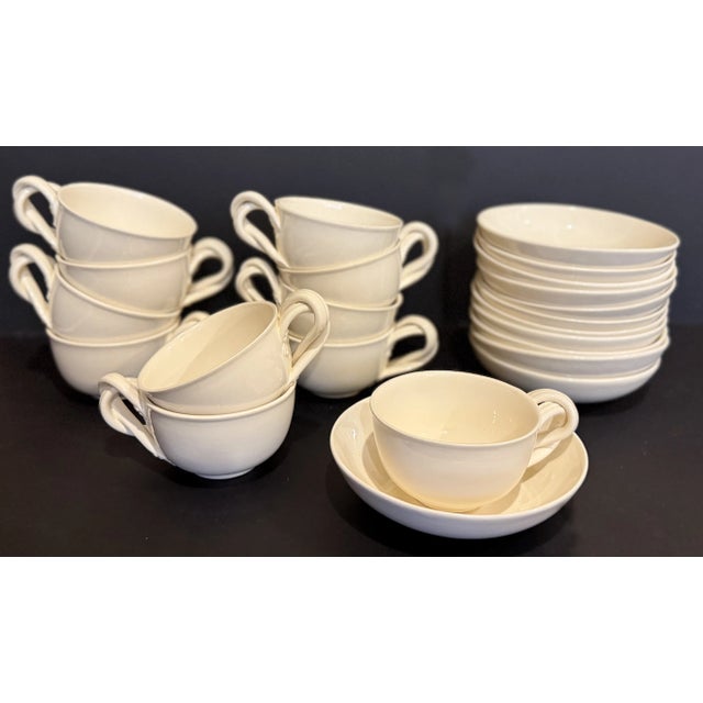 Made in Leeds England, this historic pattern of creamware tea cups consists of a 11 cups and 12 saucers. Each piece is...
