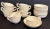 Made in Leeds England, this historic pattern of creamware tea cups consists of a 11 cups and 12 saucers. Each piece is...