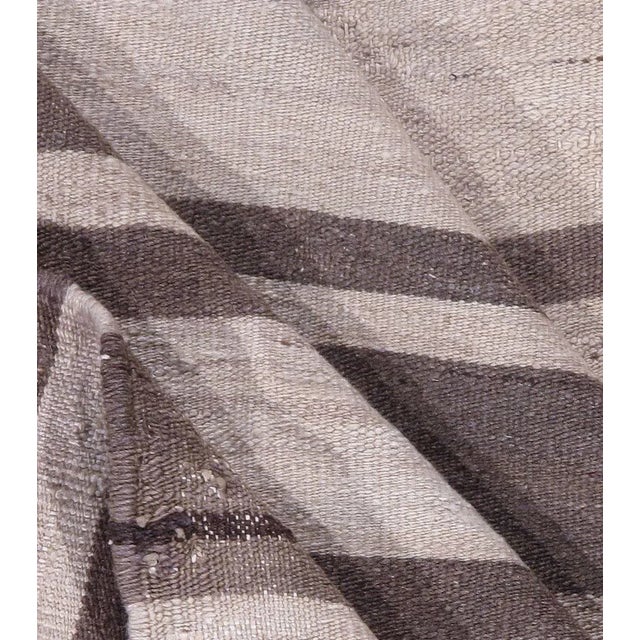 This vintage Turkish flat-weave Kilim was handwoven in the 1940s. The simplicity and boldness of these pieces can also...