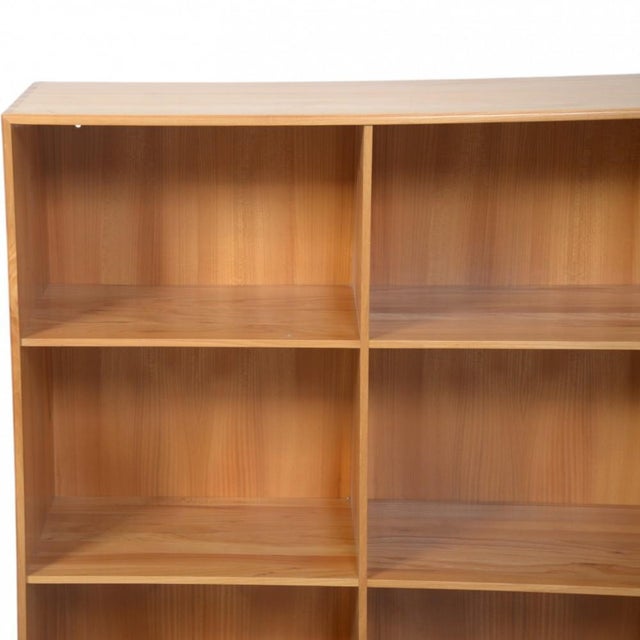 Mogens Koch bookcase made of elm, and from the 1970s. The bookcase appears in good condition, with a few marks and...