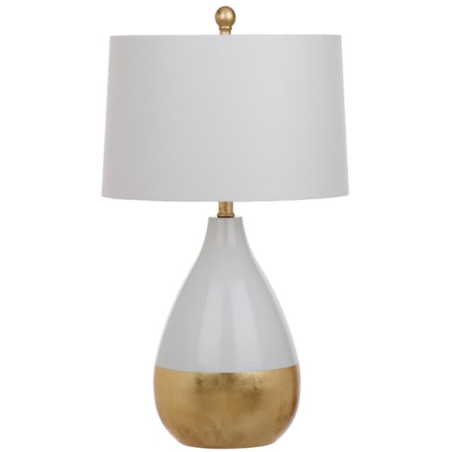 The decadent décor of a London’s designer’s lush home inspired this set of 24-inch white and gold table lamps. Place on...