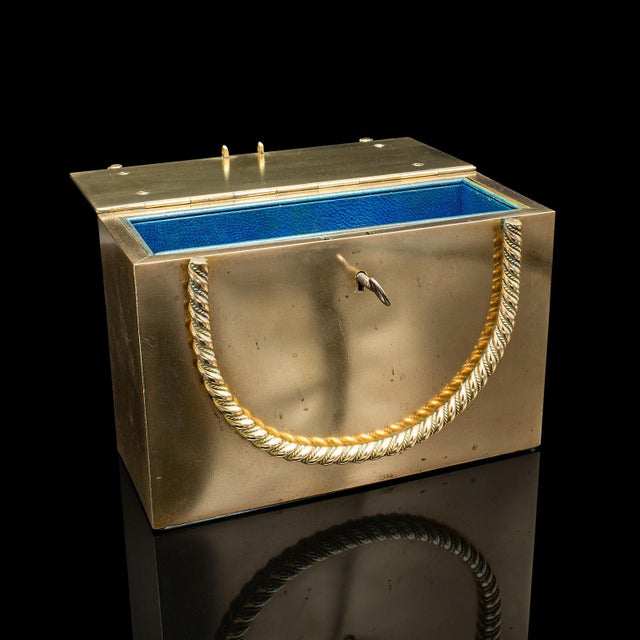 This is an antique strong box. An English, brass and bronze secret letter or valuables case, dating to the Regency period,...