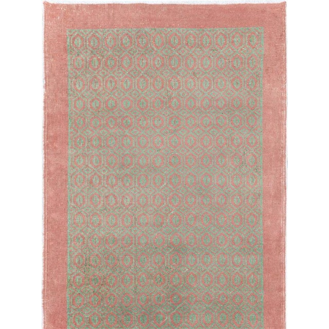 This mid-20th-century Turkish Anatolian long runner presents a refined allover composition of tightly repeated oval and...