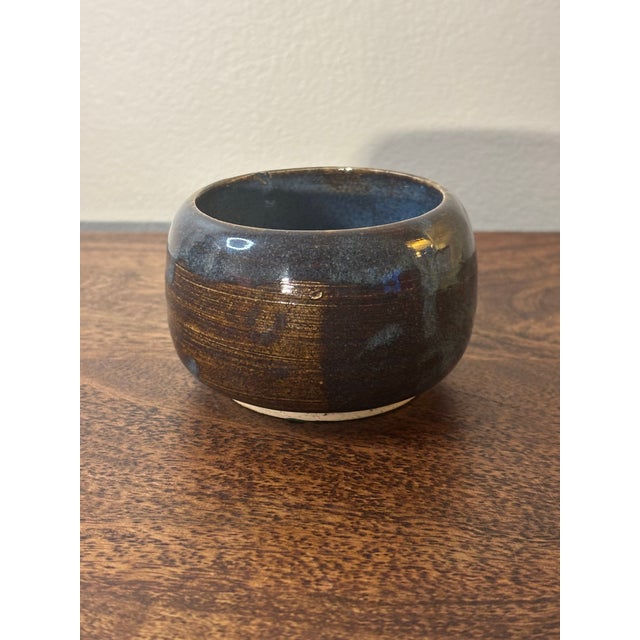 Attractive mid century modern studio ceramic bowl. Combination of blues and brown glaze create a beautiful dark shadowy...