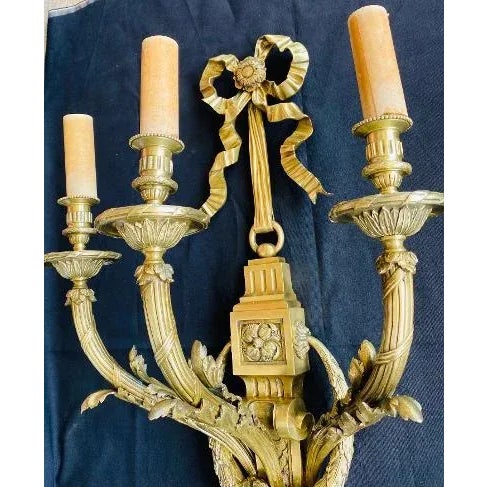 Large three light French bronze electrified wall sconce in Louis The 16th style . Lacquered bronze with fine chasing of...