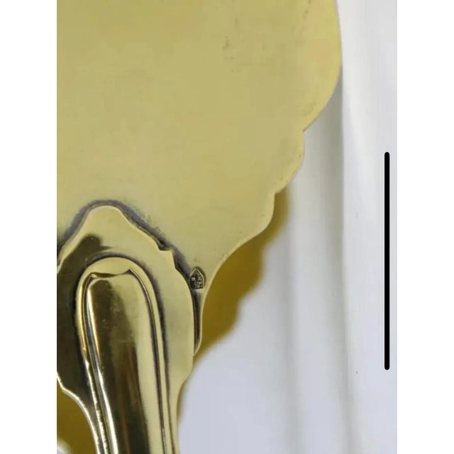 A beautiful pair of vintage mid-century gilt solid silver asparagus serving tongs made by Cartier! In excellent condition,...