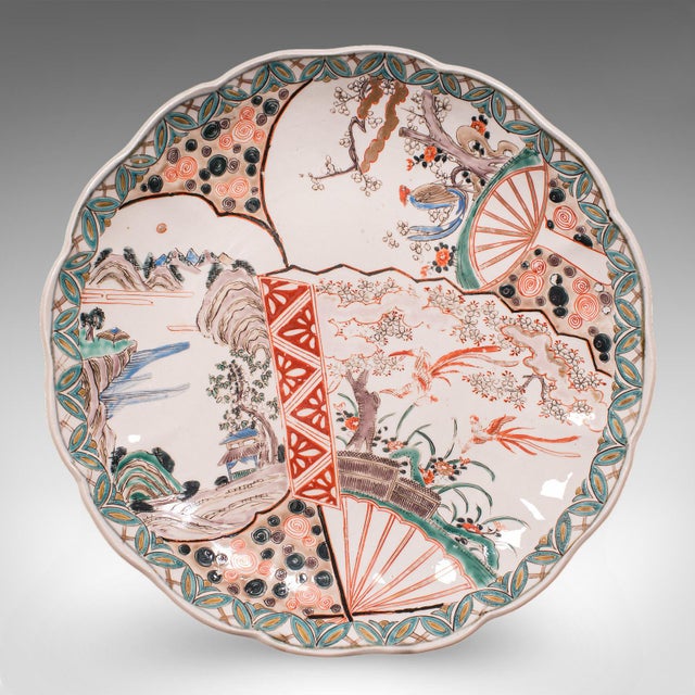 This is an antique Imari fruit plate. A Japanese, Meiji era ceramic charger, dating to the late Victorian period, circa...