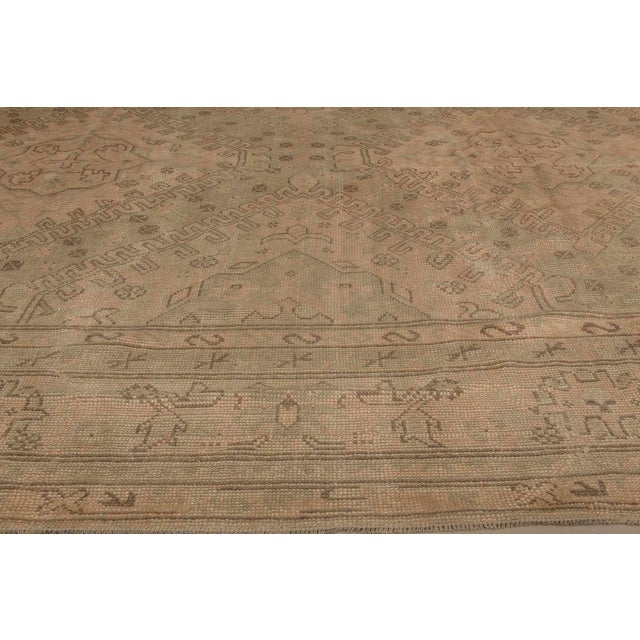 This rare and refined antique Turkish Oushak rug from the late 19th century beautifully encapsulates the essence of...