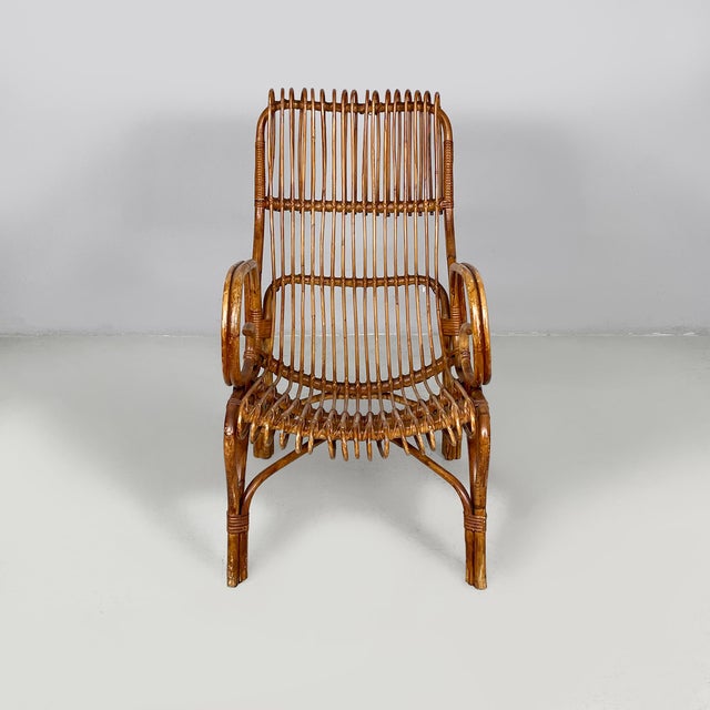 Italian mid-century modern armchairs with armrest in rattan, 1960s Set of three rattan armchairs. The seat and backrest...