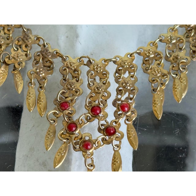 Vintage statement fringe bib necklace designed in an ornate Etruscan and Victorian Revival style featuring a tiered...