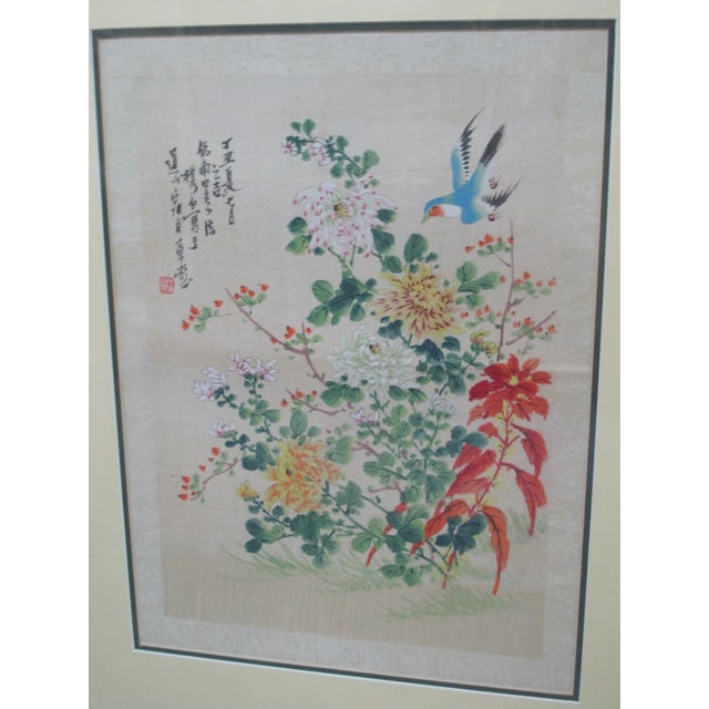 Very sweet Chinese antique painting on fabric of a flying blue bird amongst color flower blossoms. Frame measures, 20 1/2"...