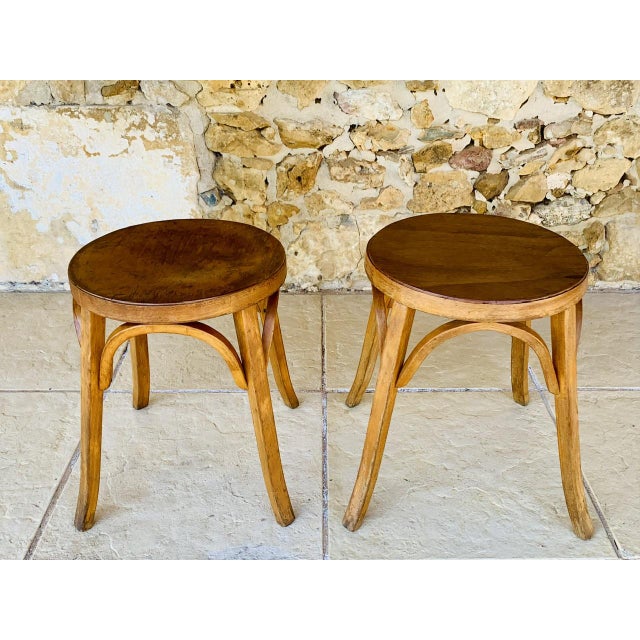 Set of 2, mid-century, vintage, "Model #92" stool by Baumann, France, from the 1950's. They are made of beech, with a...
