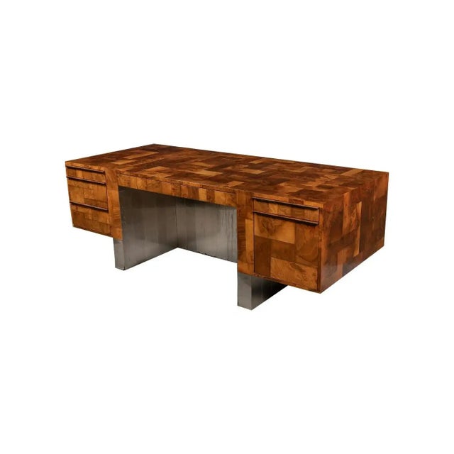 A striking and highly collectible patchwork burl executive desk designed by Paul Evans for Directional, circa 1970s. This...