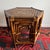 Vintage Set of three vintage nesting tables crafted from bent bamboo and handwoven rattan. The hexagonal tops feature an...