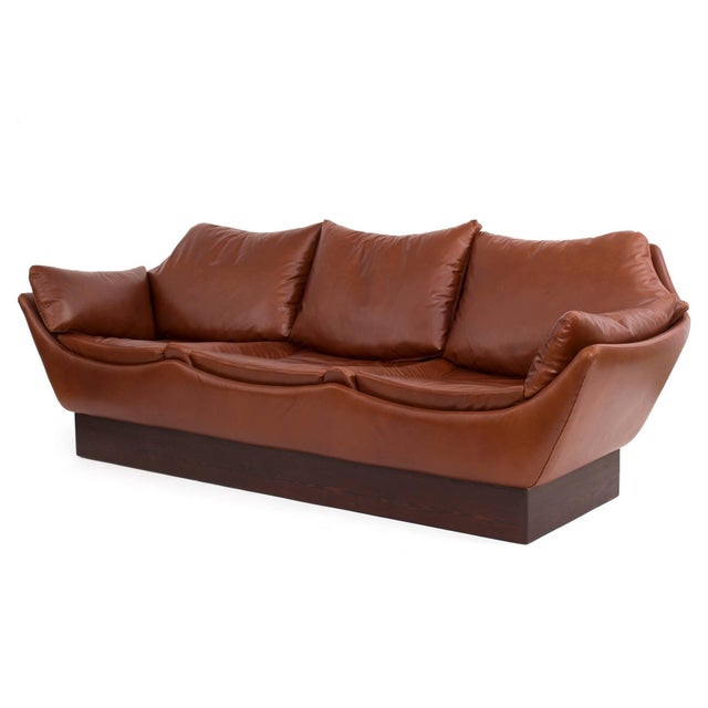 Phenomenal wavy leather sofa from Denmark, circa early 1970s. This unusual example has French seaming throughout and has...