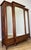 This elegant Antique French wardrobe is a striking piece featuring beautiful French inlay decoration, mirrored doors, and...