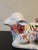 Adorable Italian ceramic vintage turee. Adorned with bows around the neck and on top. Handpainted florals and marked on...