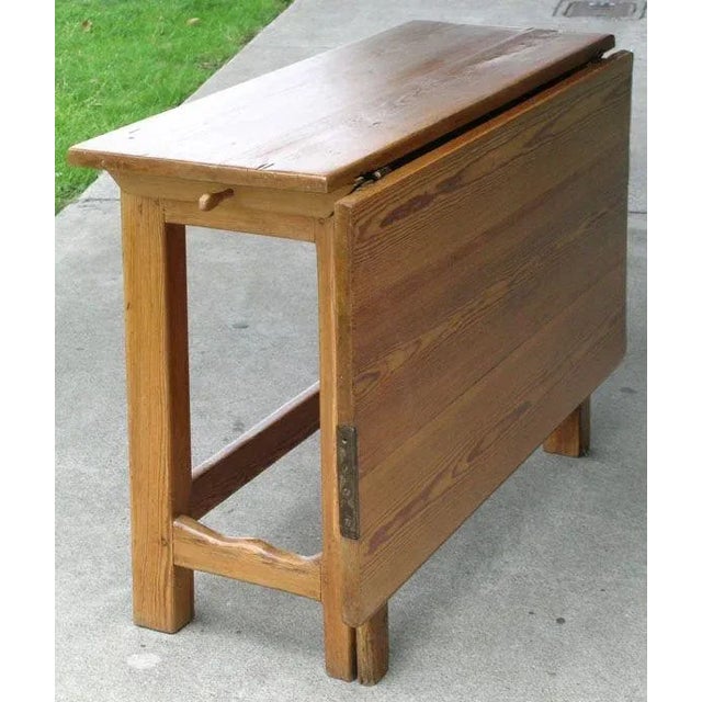 Classic Swedish style gate leg table with one drop leaf. The top can be separated from the base by pulling out a peg on...