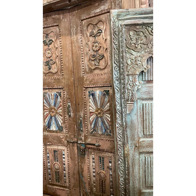 Elevate your space with these magnificent antique Indo-French double doors, expertly handcrafted from solid teak wood and...