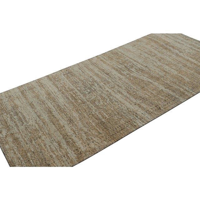 Hand-knotted in wool and art silk, this 4×9 abstract runner rug from Rug & Kilim’s Modern Collection is a work of simple...