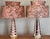 Presenting a pair of authentic Mid-Century ceramic lamps in Atomic Era pink and black with gold accents. It is rare to...