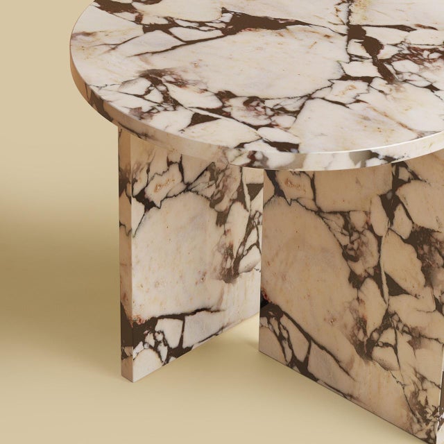 Calacatta Viola marble gives the Kyushu its register. This is a low, compact table, built so that the marble carries the...