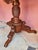 Hand-carved 19th century game table on a central leg divided by a tripod. Fine floral carving. Inside the table is a...