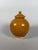 Covered terracotta vase with amber glaze, Tang Dynasty (618-907) For Sale