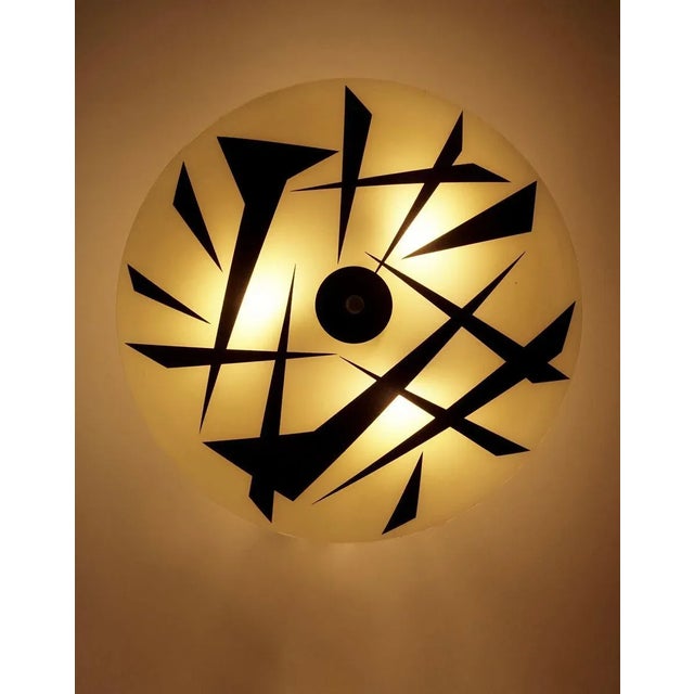 Glass wall lamp from designfornification. This is our own design based on a vintage glass plate, that was produced in...