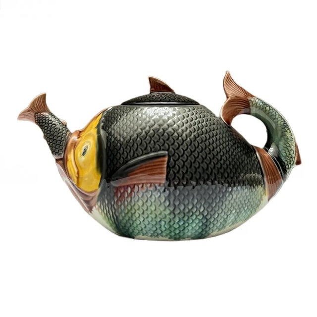 Rare Majolica Teapot with lid "Fish Swallowing Fish." English, circa 1870. Please note chip on the inside lip.