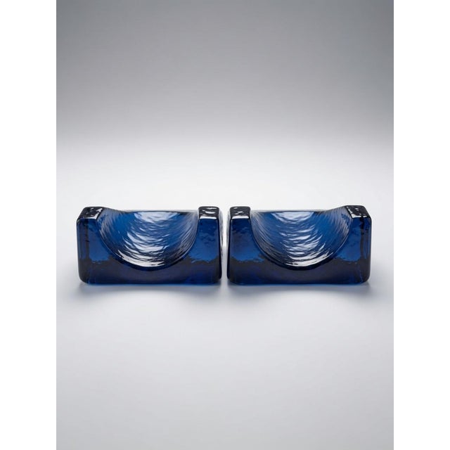 The Blenko Cobalt Blue Art Glass Bookends designed by Wayne Husted embody the modern style and artistic flair of Mid-...