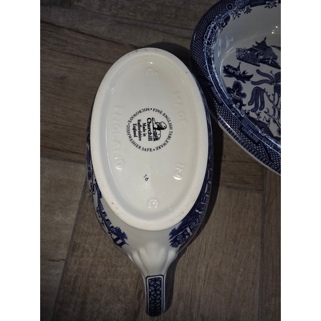 Vintage group of Blue Williw pattern serveware. A teapot 9.5"w by 7"d by 7"w A gravy boat 8.25"w by 3.5" d by 4"h Two...