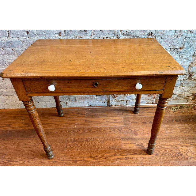 This Antique oak Teacher's Desk with a large drawer is perfect as a writing desk or just as a catchall table that adds a...