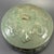 Fine antique Chinese celadon covered jar. Bulbous body adorned with raised relief motifs, matching decorated lid, natural...
