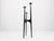 Large tripod candlestick in hammered wrought iron, made in Europe around the 1960s. Its architectural silhouette is...