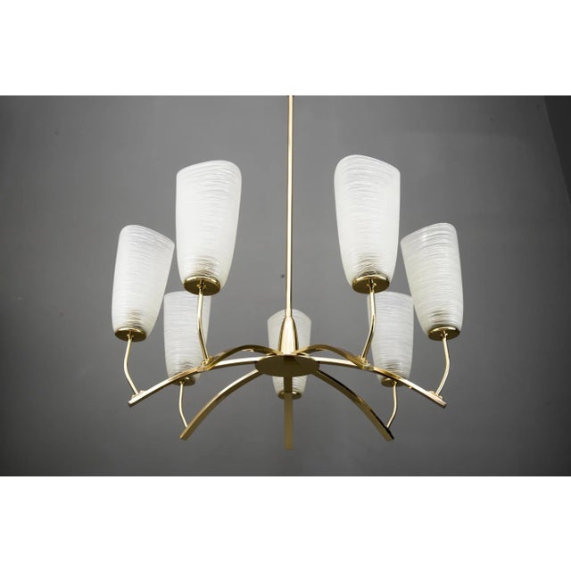 Italian chandelier circa 1960s Polished and stove enamelled. European Plug (up to 250V).The wiring of this item may be...