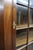 Classic Henkel Harris two-piece mahogany corner cabinet featuring a glazed upper display section with divided-light glass...