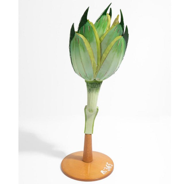 The original school model from the 1950s, representing a wheat flower. The flower is mounted vertically on a wooden...
