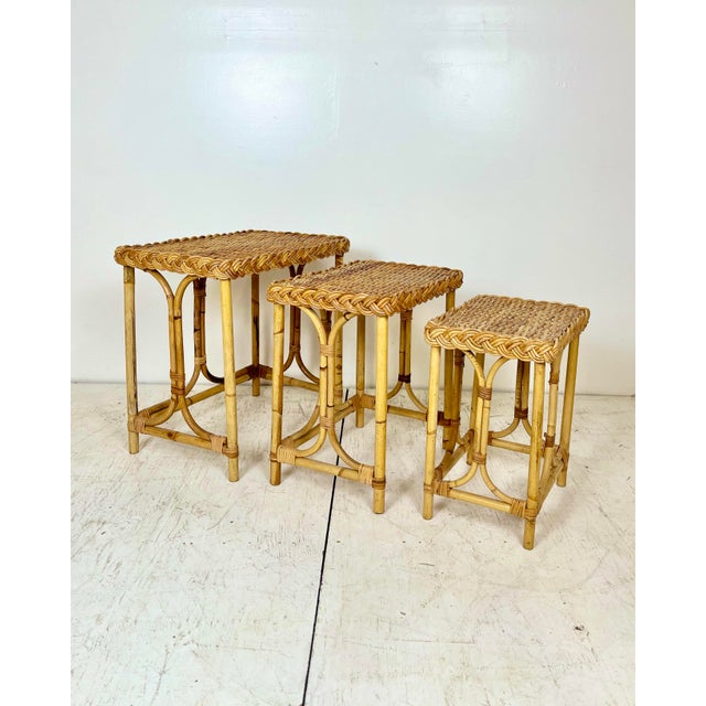Vintage set of 3 rattan wicker nesting tables. Nesting side tables perfect to pull out for cocktails, as plant stands,...