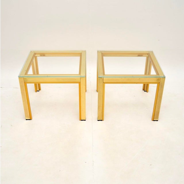 A very stylish and well made pair of vintage Italian brass side tables by Zevi, dating from the 1970s. They are of superb...